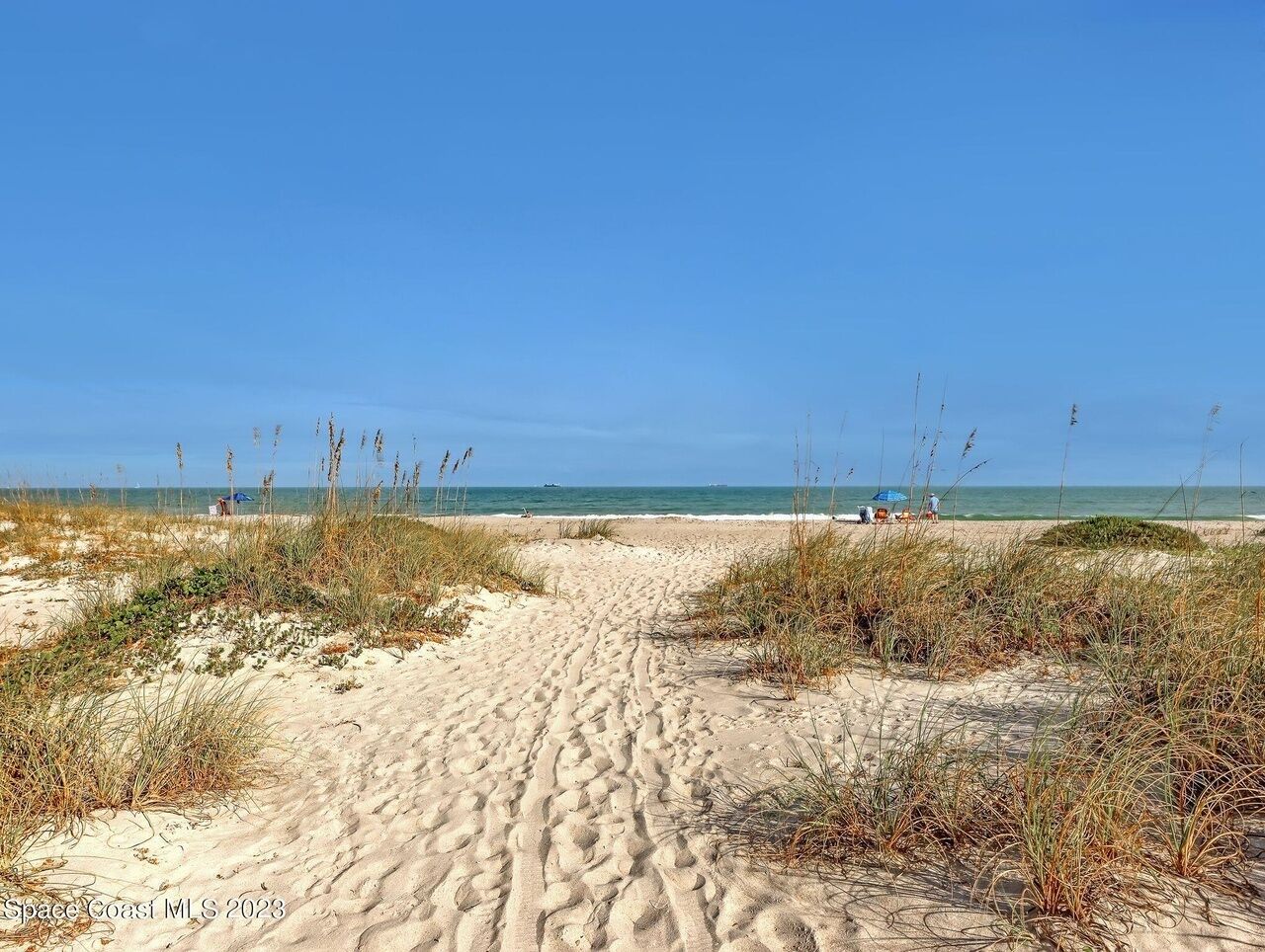 On the beach, sun loungers, beach towels
