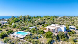 A resort with a swimming pool, multiple buildings, and a view of the sea. - Pool villa near the beaches w/ fantastic sea view (Torre Pali)