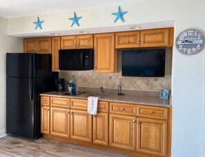 Fridge, microwave, stovetop, coffee/tea maker