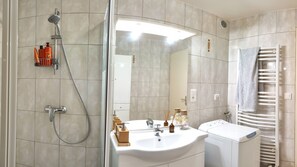 Shower, hair dryer, towels, soap