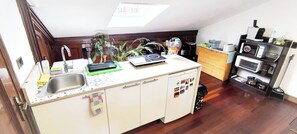 Fridge, microwave, stovetop, coffee/tea maker