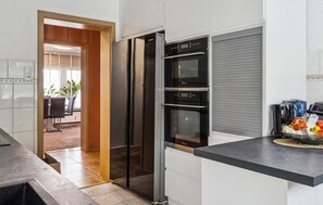 Fridge, stovetop, dishwasher, coffee/tea maker