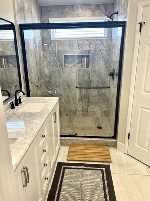Shower, hair dryer, towels, soap