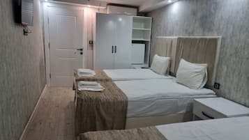 Family Room | Premium bedding, in-room safe, blackout curtains, iron/ironing board