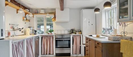 Fridge, stovetop, dishwasher, coffee/tea maker
