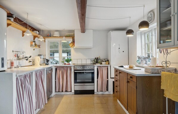 Fridge, stovetop, dishwasher, coffee/tea maker