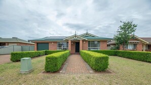 A building with a brick facade, a green roof, and a central entrance. - Windsor. Backyard Entertainer. Dubbo. (Dubbo)