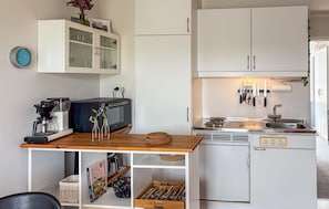 Fridge, stovetop, coffee/tea maker, cookware/dishes/utensils