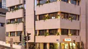 A modern building with the sign "LOGINN" prominently displayed. - Savanna Dizengoff - Smart Hotel by Loginn Tel Aviv (Tel Aviv)