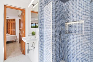 Shower, hair dryer, towels, toilet paper