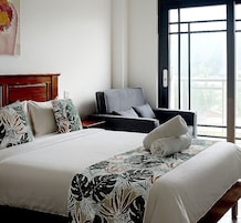 Superior Double Room | Living area | 40-inch flat-screen TV with digital channels