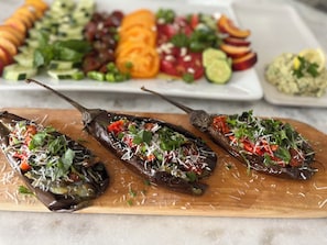 A wooden board with roasted peppers stuffed with vegetables and cheese. - Private Room &Bathroom, Quaint Beach Town, Free local beaches, Ferry to NYC (Highlands)