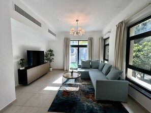 Exclusive Apartment | Living area - Lux BnB Travo Tower I Private Garden I Lake View (Dubai)