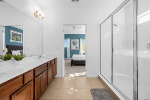 Shower, hair dryer, towels, shampoo