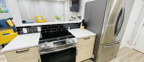 Coffee/tea maker, fridge, microwave, oven