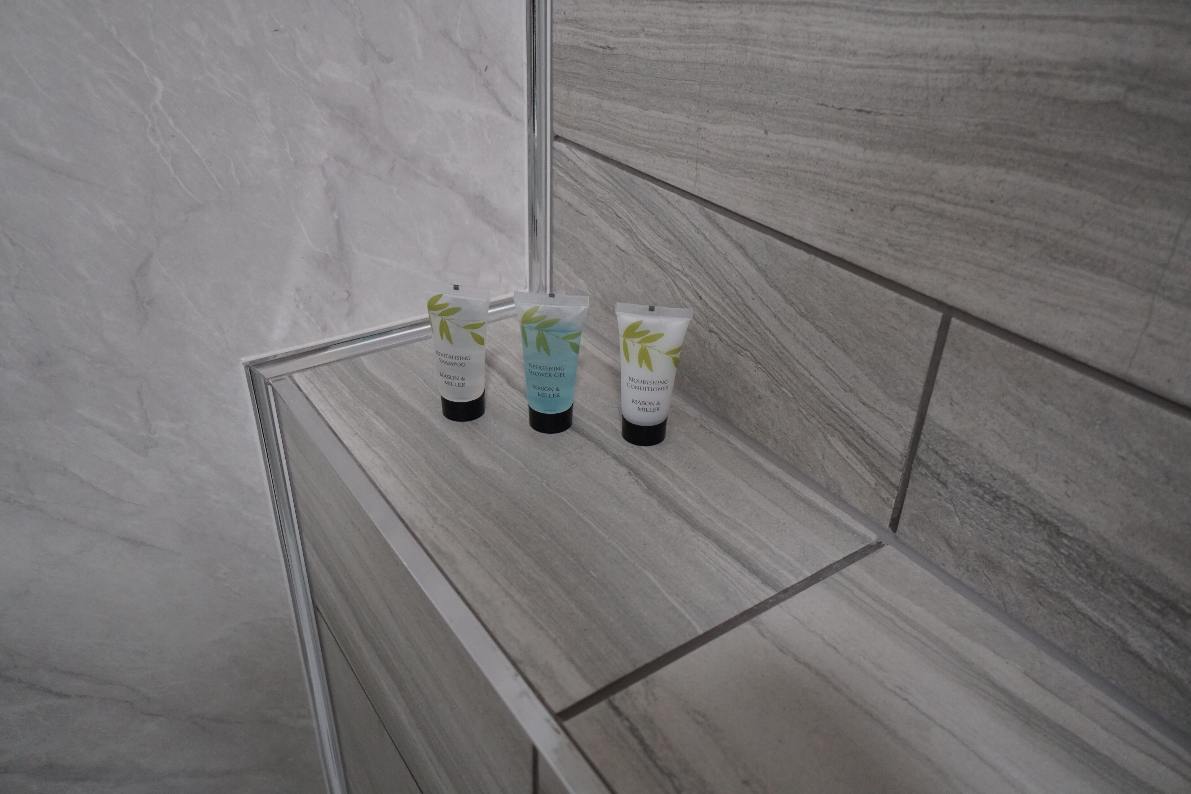 City Studio | Bathroom | Shower, rainfall showerhead, designer toiletries, hair dryer