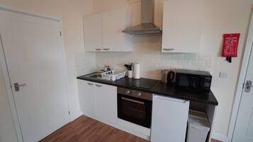 Premium Apartment | Private kitchen | Fridge, microwave, oven, stovetop