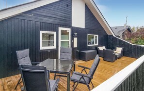 Relax on the deck with a glass-top table and comfortable seating for four.