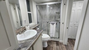 Shower, hair dryer, towels, soap