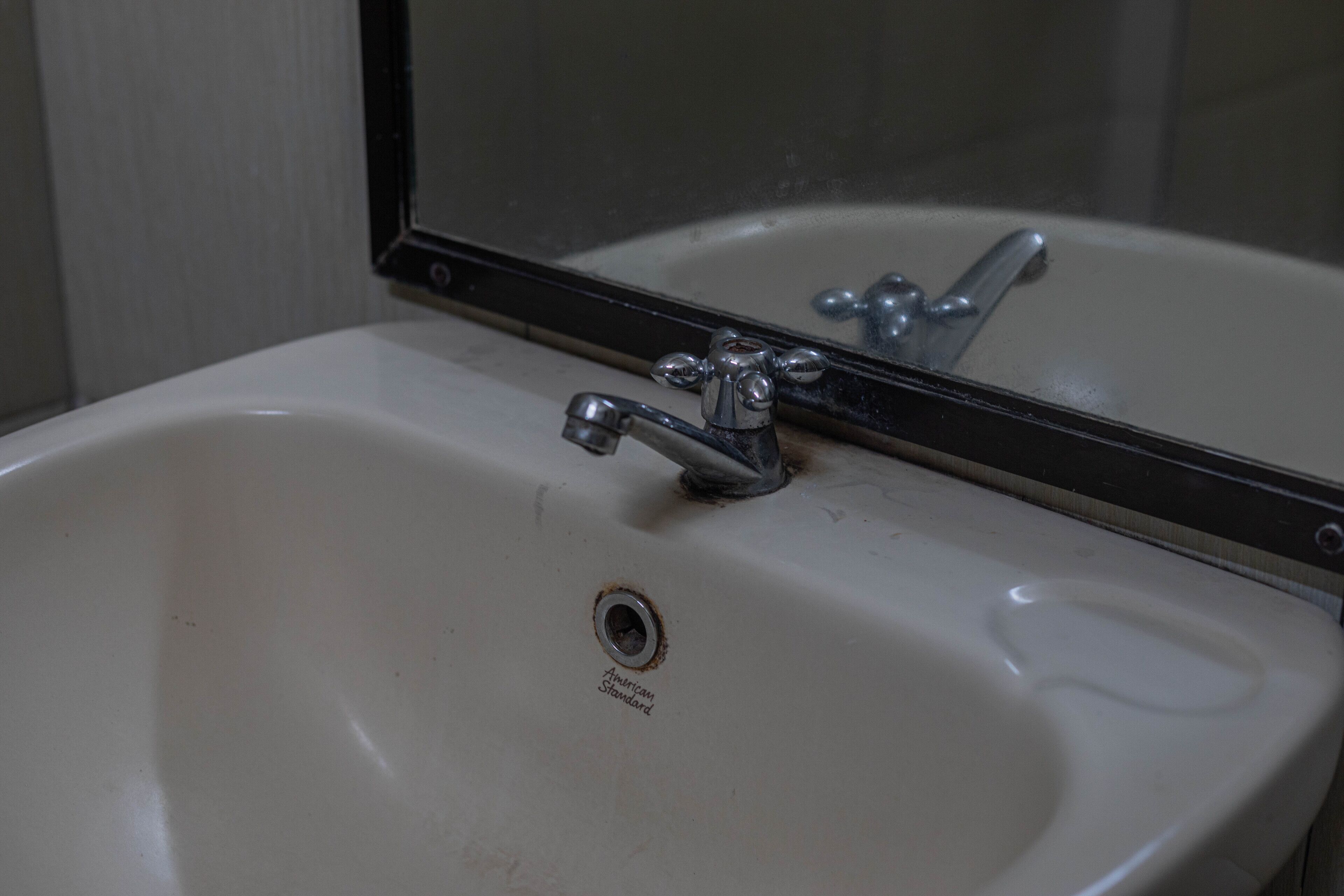 A bathroom sink with a mirror above it.