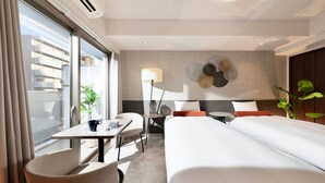 A hotel room with a large window, a desk with a chair, a bed, a small table, and a decorative wall piece. - Doutonboricrystalhotel3 (Osaka)