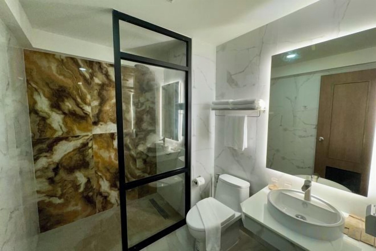 Bathroom | Shower, hydromassage showerhead, designer toiletries, hair dryer