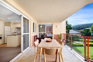 Enjoy a peaceful retreat with a spacious balcony overlooking a well-maintained garden.
