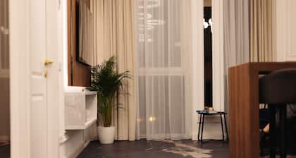 Modern¢ral apartment with a gorgeous bathtub inside one of the two bedrooms.