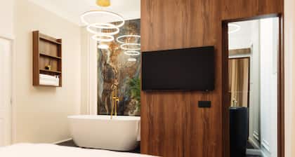 Modern¢ral apartment with a gorgeous bathtub inside one of the two bedrooms.