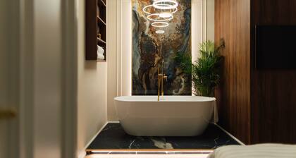 Modern¢ral apartment with a gorgeous bathtub inside one of the two bedrooms.