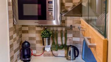 Fridge, microwave, stovetop, coffee/tea maker