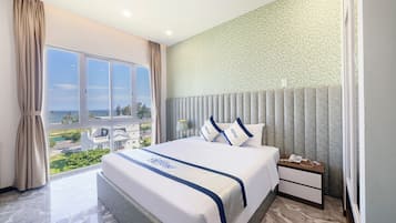 Deluxe Double Room, Sea View | Minibar, in-room safe, free WiFi, bed sheets
