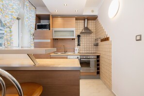 Apartment, 1 Bedroom, Kitchen | Private kitchen | Microwave, oven, dishwasher, coffee/tea maker - Daszyńskiego Apartment Cracow by Renters (Kraków)