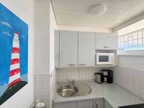 Fridge, microwave, stovetop, coffee/tea maker