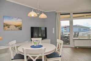 Enjoy a comfortable stay with a large flat-screen TV, dining area, and balcony with outdoor seating.