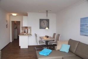 Enjoy a comfortable stay in this stylish living space with a dining area, sofa, and modern amenities.