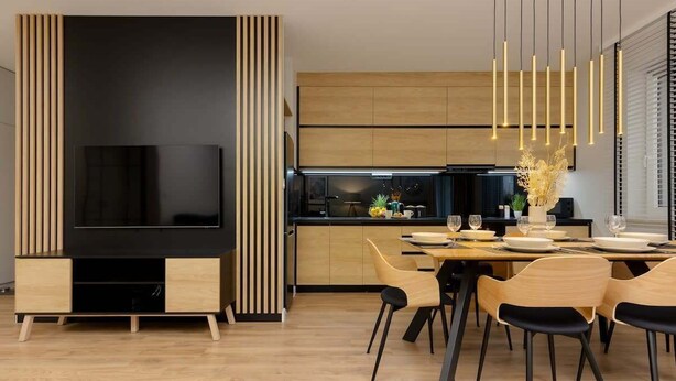 A modern kitchen with wooden cabinets, a black TV stand, and a dining area with wooden chairs and a table set for four.