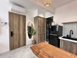 Enjoy cooking in this well-equipped kitchen with a central island, oven, and refrigerator.
