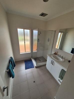 Shower, hair dryer, towels, soap