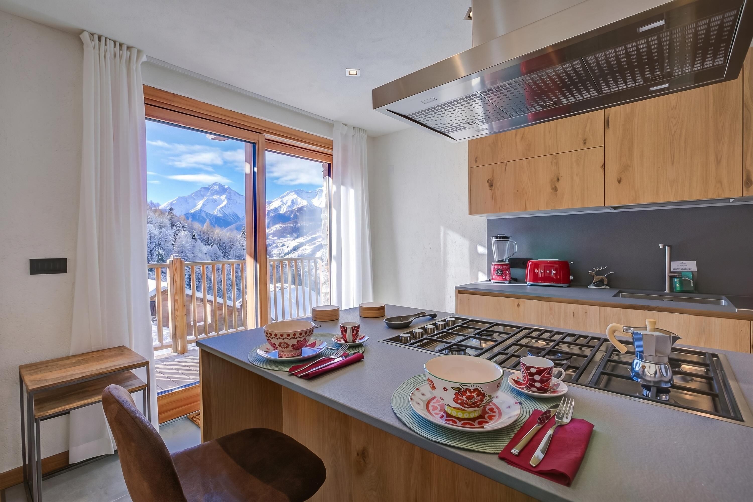Family Chalet, Multiple Bedrooms (Chalet Merveille Ski In - Ski Out) | Private kitchen | Fridge, microwave, oven, stovetop