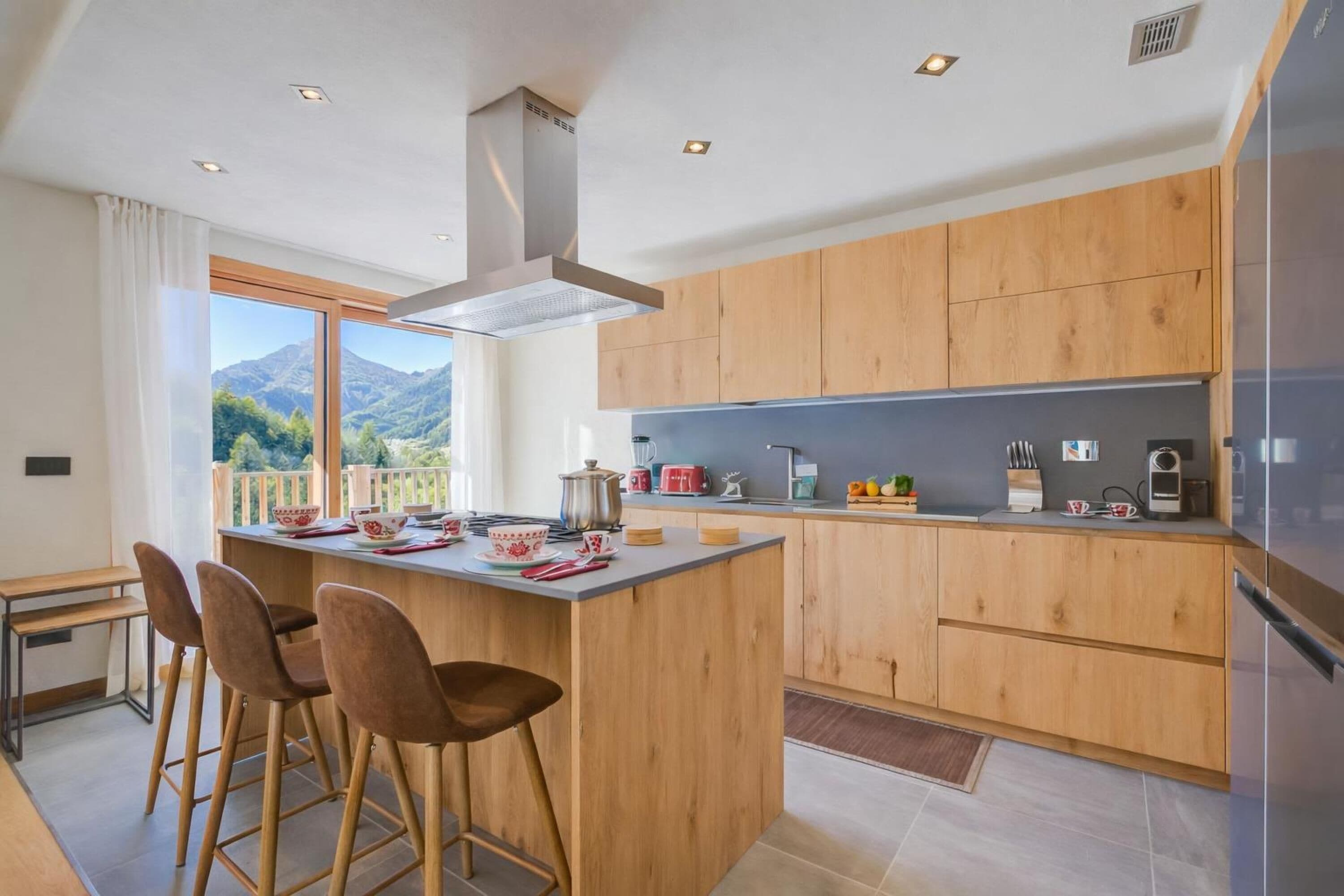Family Chalet, Multiple Bedrooms (Chalet Merveille Ski In - Ski Out) | Private kitchen | Fridge, microwave, oven, stovetop