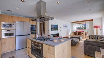 Family Chalet, 4 Bedrooms (Chalet Merveille Ski In - Ski Out) | Private kitchen | Fridge, microwave, oven, stovetop
