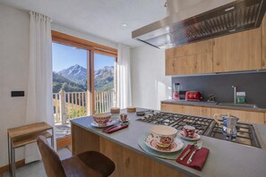 Family Chalet, Multiple Bedrooms (Chalet Merveille Ski In - Ski Out) | Private kitchen | Fridge, microwave, oven, stovetop - Chalet Merveille Ski In - Ski Out (Sauze d'Oulx)