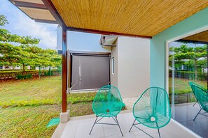 Relax on the patio surrounded by lush greenery and enjoy the garden views.