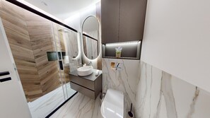 Shower, hair dryer, bidet, towels