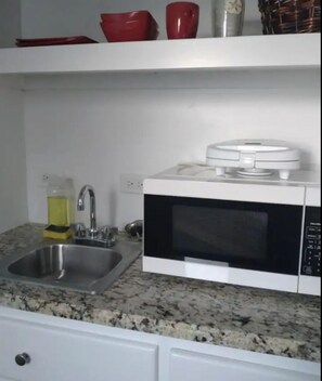 Fridge, microwave, electric kettle, cookware/dishes/utensils