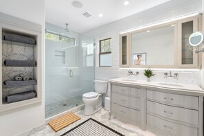 Shower, hair dryer, towels, soap