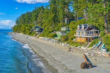 Image of Beachfront cottage with expansive deck, grill, elegant interior, games, & W/D