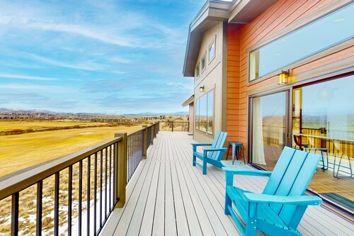 Dog-friendly golf course-front home with mtn & ski views, fireplace, & balconies