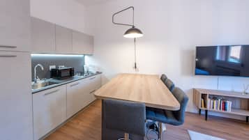 Apartment | Living area | 40-inch flat-screen TV with digital channels, streaming services